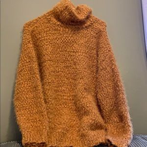 orange textured turtleneck sweater